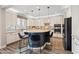 Modern kitchen featuring a center island, stylish seating, and stainless steel appliances, perfect for culinary enthusiasts at 21030 E Misty Ln, Queen Creek, AZ 85142