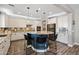 Spacious kitchen featuring a center island, modern appliances, and ample counter space, perfect for cooking and entertaining at 21030 E Misty Ln, Queen Creek, AZ 85142