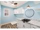 Bright laundry room featuring granite countertops, storage, and modern fixtures at 21030 E Misty Ln, Queen Creek, AZ 85142