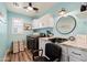 This laundry room is highlighted by modern fixtures, granite counters, and ample storage space at 21030 E Misty Ln, Queen Creek, AZ 85142