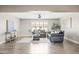 Welcoming living room with hardwood floors, a cozy rug, and comfortable seating ideal for gatherings at 21030 E Misty Ln, Queen Creek, AZ 85142