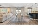 Open-concept living room seamlessly flows into the kitchen and dining areas, creating a welcoming and inclusive atmosphere at 21030 E Misty Ln, Queen Creek, AZ 85142