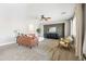 Open-concept living room featuring comfortable seating, modern decor, and a stylish accent wall at 21030 E Misty Ln, Queen Creek, AZ 85142