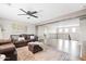 Expansive living room showcasing wood floors, comfortable seating, and easy access to the second floor at 21030 E Misty Ln, Queen Creek, AZ 85142