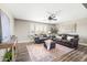 Inviting living room features wood floors, comfortable seating, and decor for an inviting space at 21030 E Misty Ln, Queen Creek, AZ 85142