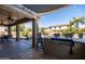Covered patio featuring an outdoor kitchen with a grill, ideal for backyard barbecues and entertaining guests at 21030 E Misty Ln, Queen Creek, AZ 85142