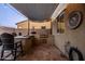 Well-equipped outdoor kitchen with a built-in grill, counter space, and a shade, perfect for outdoor cooking at 21030 E Misty Ln, Queen Creek, AZ 85142
