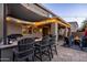 Spacious outdoor kitchen and bar area with barstool seating, creating a delightful space for entertaining at 21030 E Misty Ln, Queen Creek, AZ 85142