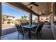 Spacious covered patio perfect for outdoor dining, overlooking a lush backyard and a sparkling pool at 21030 E Misty Ln, Queen Creek, AZ 85142