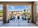 This covered patio features a view of the pool and includes Adirondack chairs and string lights at 21030 E Misty Ln, Queen Creek, AZ 85142