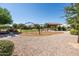 Community playground featuring a climbing structure, swing set, seating areas, and attractive, desert-friendly landscaping at 21030 E Misty Ln, Queen Creek, AZ 85142