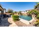 Private pool area with lush landscaping and comfortable seating, perfect for relaxation and enjoying the outdoors at 21030 E Misty Ln, Queen Creek, AZ 85142