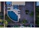 This overhead shot highlights a pool with lounge furniture, lush plants and other backyard features at 21030 E Misty Ln, Queen Creek, AZ 85142