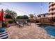 Serene backyard pool with lounge chairs and decorative umbrellas, ideal for relaxing and enjoying the outdoors at 21030 E Misty Ln, Queen Creek, AZ 85142