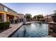 Inviting backyard pool and patio area, perfect for outdoor relaxation and entertaining with a covered patio at 21030 E Misty Ln, Queen Creek, AZ 85142