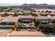 Inviting backyard featuring a swimming pool, lush landscaping, and a covered patio at 21030 E Misty Ln, Queen Creek, AZ 85142