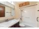 Bathroom featuring a vanity with solid surface counter and a tub with a shower at 2321 W Claremont St, Phoenix, AZ 85015