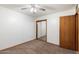 Bedroom featuring neutral carpet and a sliding-door closet at 2321 W Claremont St, Phoenix, AZ 85015