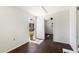 Bright entryway leading to a room with ceiling fan, window, and neutral walls at 2321 W Claremont St, Phoenix, AZ 85015