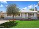 Charming single-story home featuring a well-maintained front yard and charming brick accents at 2321 W Claremont St, Phoenix, AZ 85015
