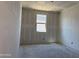 Bedroom featuring unfinished walls, an installed window, and an unfinished ceiling at 24090 W Sunland Ave, Buckeye, AZ 85326