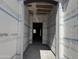 Interior view shows a framed entryway revealing construction with exposed framing and wiring at 24090 W Sunland Ave, Buckeye, AZ 85326