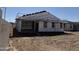 New construction shows framing, patio, and siding, ready to be a stunning home at 24090 W Sunland Ave, Buckeye, AZ 85326