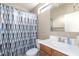Well-maintained bathroom featuring a shower curtain, window and single sink at 2725 E Mine Creek Rd # 2186, Phoenix, AZ 85024