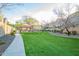 A verdant green space and playground area in the community at 2725 E Mine Creek Rd # 2186, Phoenix, AZ 85024