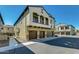 Beautiful townhome showcasing balconies, three garages, and tasteful desert landscaping at 2725 E Mine Creek Rd # 2186, Phoenix, AZ 85024