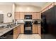 Spacious kitchen featuring granite counters, stainless steel appliances, and light wood cabinets at 2725 E Mine Creek Rd # 2186, Phoenix, AZ 85024