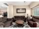 A living room with a mirror on the wall, neutral color paint, and stylish furniture at 2725 E Mine Creek Rd # 2186, Phoenix, AZ 85024