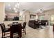 Open concept living room, kitchen, and dining area with tile flooring and neutral walls at 2725 E Mine Creek Rd # 2186, Phoenix, AZ 85024