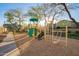Community playground with modern play equipment, set in a landscaped area with mature trees at 2725 E Mine Creek Rd # 2186, Phoenix, AZ 85024