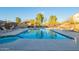 Outdoor community pool with ample lounge chairs for relaxation on the pool deck at 2725 E Mine Creek Rd # 2186, Phoenix, AZ 85024