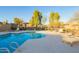 Inviting community pool area featuring well-maintained landscaping and various seating options at 2725 E Mine Creek Rd # 2186, Phoenix, AZ 85024