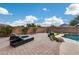 Beautiful backyard with a pool, lounge chairs, and lush plants creating a relaxing outdoor oasis at 29437 W Columbus Ave, Buckeye, AZ 85396