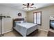 A comfortable bedroom featuring ceiling fan, closet, and plenty of natural light at 29437 W Columbus Ave, Buckeye, AZ 85396