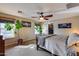 Bright bedroom featuring a ceiling fan, natural light, and spacious layout at 29437 W Columbus Ave, Buckeye, AZ 85396