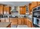 A gourmet kitchen featuring granite countertops, stainless steel appliances and custom cabinetry at 29437 W Columbus Ave, Buckeye, AZ 85396