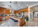Stylish kitchen with a large island, stainless steel appliances, and wood cabinets at 29437 W Columbus Ave, Buckeye, AZ 85396