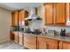 A gourmet kitchen featuring granite countertops, stainless steel appliances and custom cabinetry at 29437 W Columbus Ave, Buckeye, AZ 85396