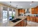 Bright kitchen featuring an island with barstool seating, pendant lighting, and stainless steel appliances at 29437 W Columbus Ave, Buckeye, AZ 85396