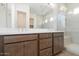 Spacious bathroom featuring double sink vanity and glass enclosed shower at 338 E Las Perlas Ln, San Tan Valley, AZ 85140