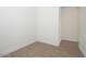 Small bedroom with tile floors, white walls and trim, and electrical outlets at 338 E Las Perlas Ln, San Tan Valley, AZ 85140
