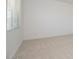 Bright bedroom featuring neutral carpet, baseboards, and window at 338 E Las Perlas Ln, San Tan Valley, AZ 85140