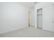 Bedroom featuring a closet with doors, neutral carpet, and baseboards at 338 E Las Perlas Ln, San Tan Valley, AZ 85140