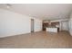 Spacious open-concept with tile floors, recessed lighting, and a view of the kitchen area at 338 E Las Perlas Ln, San Tan Valley, AZ 85140