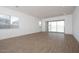 Large open-concept living room with tile floors, recessed lighting, large windows, and neutral walls at 338 E Las Perlas Ln, San Tan Valley, AZ 85140