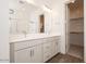 Modern bathroom with double vanity, wood-look floors, and a glass-enclosed shower for a spa-like retreat at 352 E Las Perlas Ln, San Tan Valley, AZ 85140